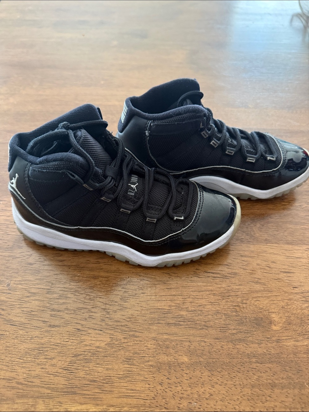 Jordan Kids Black and White High-Top Sneakers